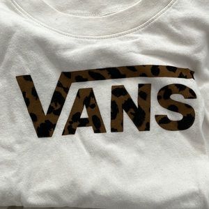 Creamish white color & cropped, I’m short so it doesn’t fit like a crop tee